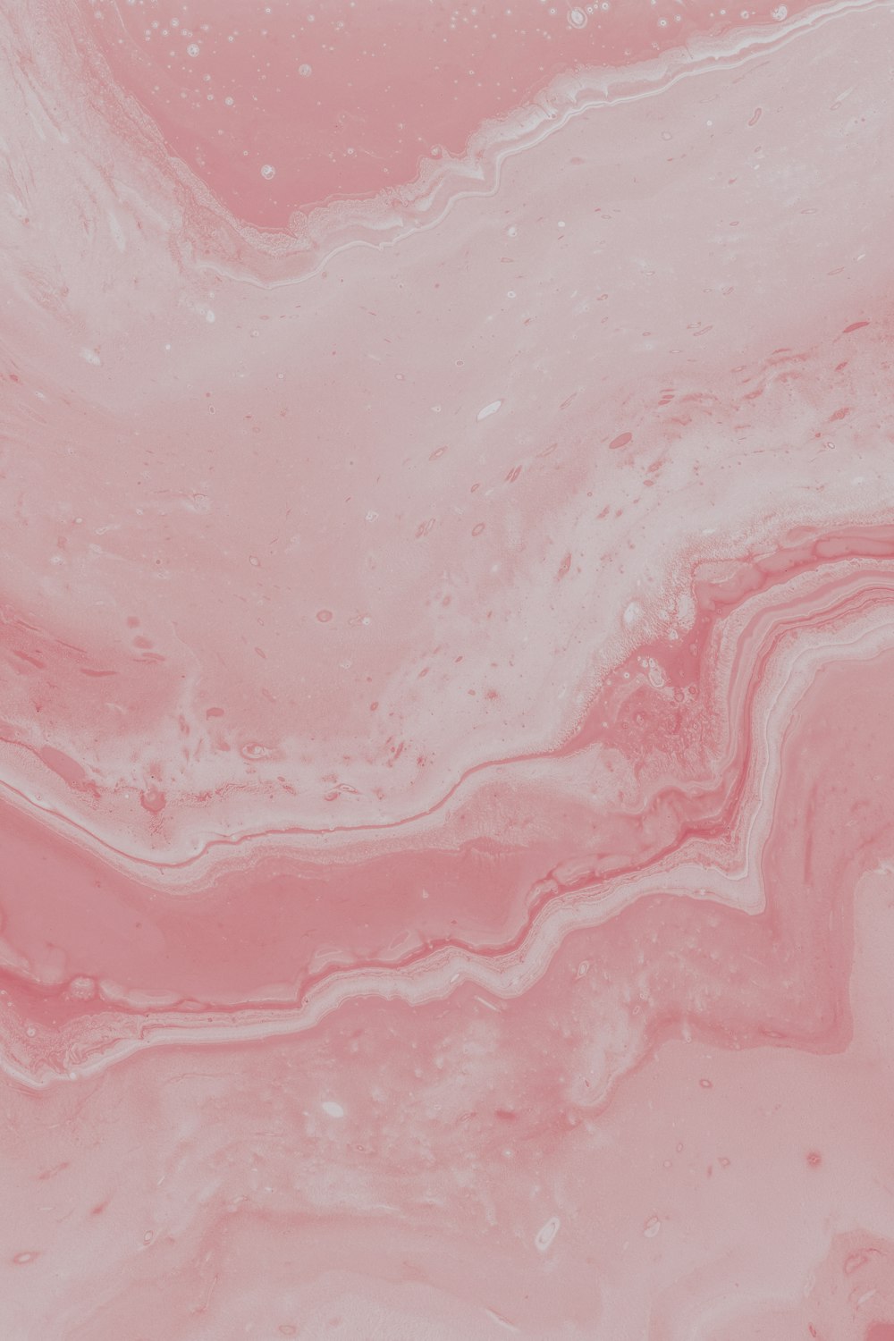 a close up of a pink marble texture