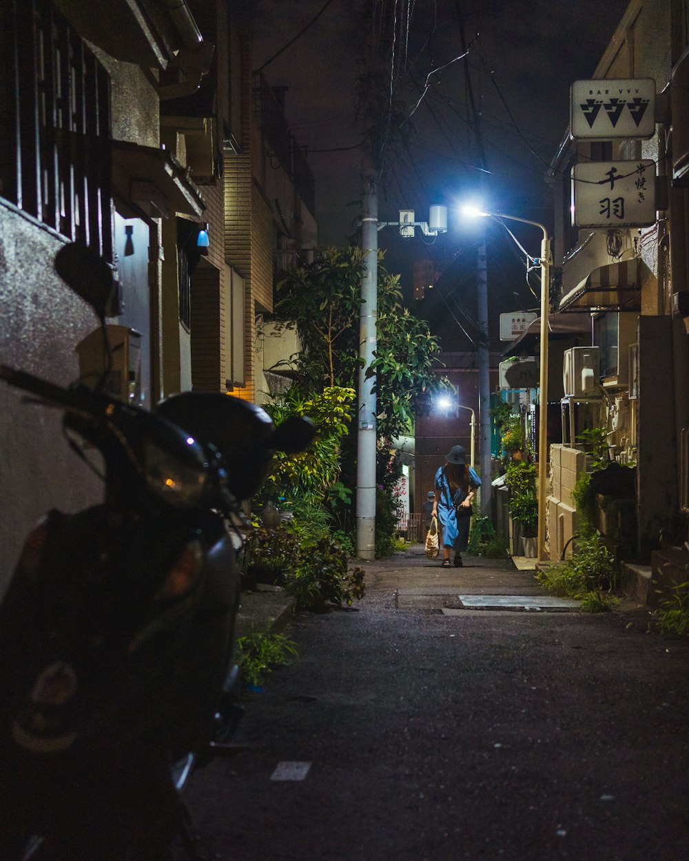 a motorcycle parked on the side of a street at night