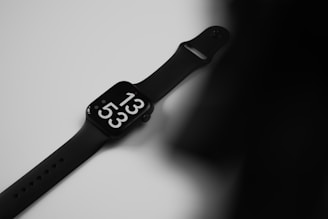 A sleek black smartwatch with a modern design on a white background.