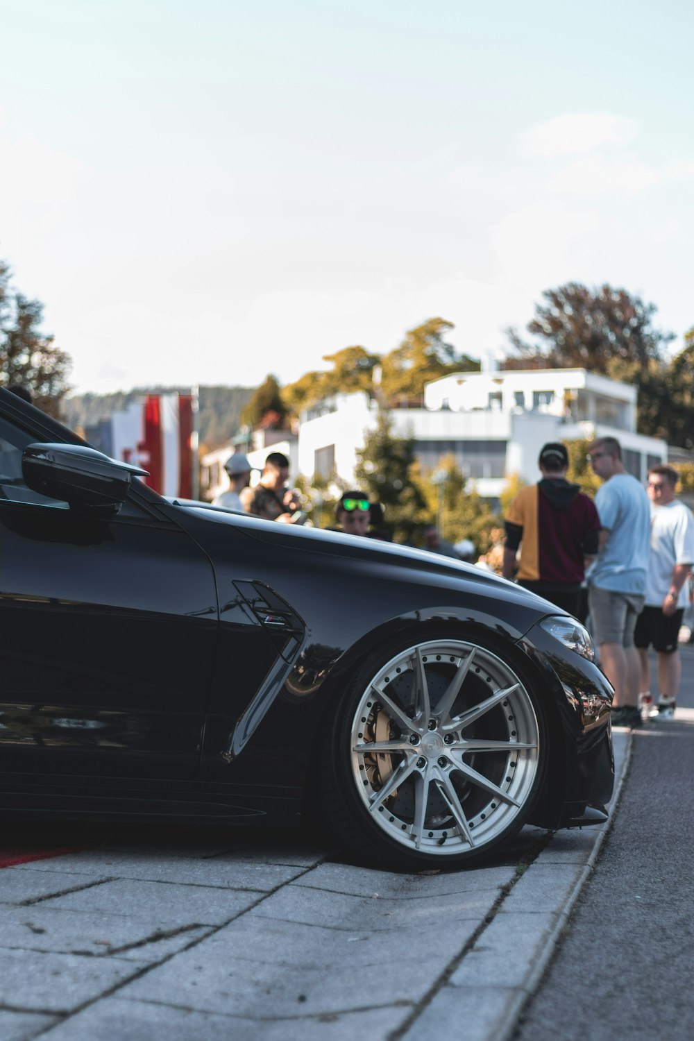 a black sports car parked on the side of the road