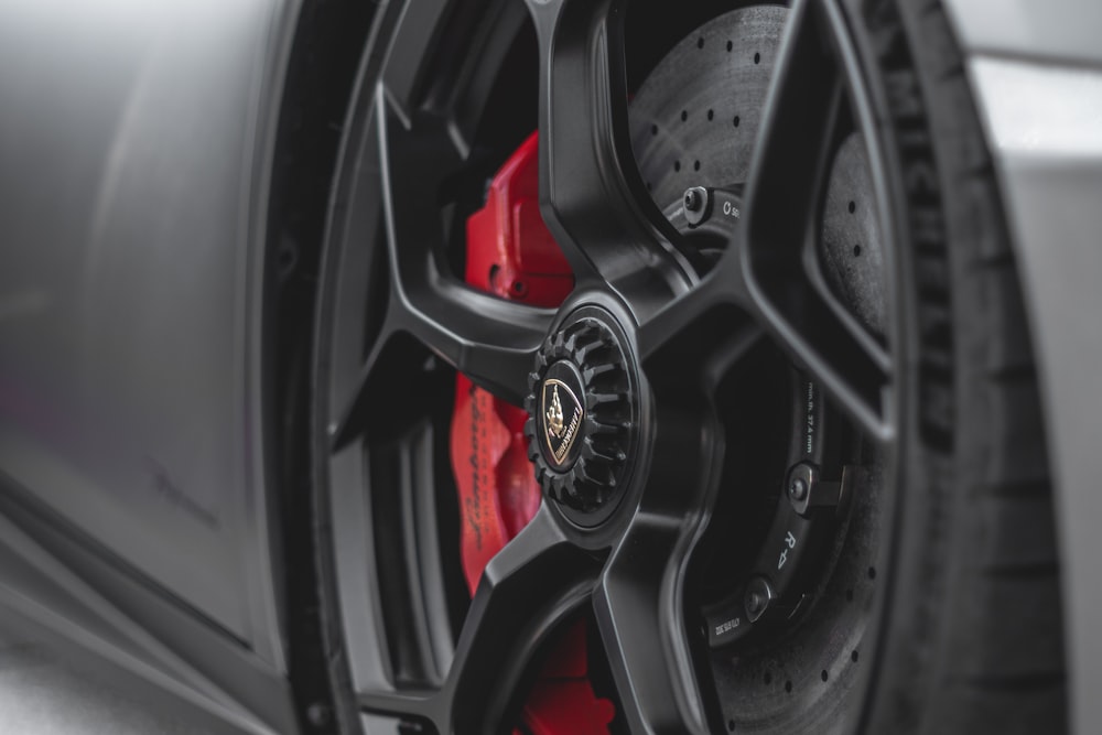 a close up of a tire on a sports car