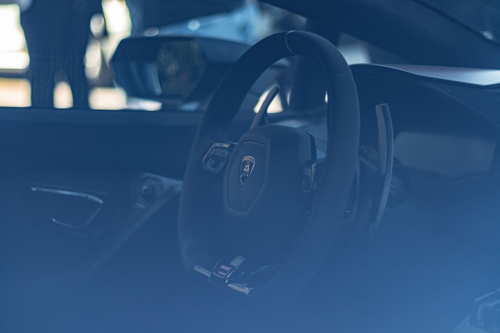 the interior of a car with a steering wheel