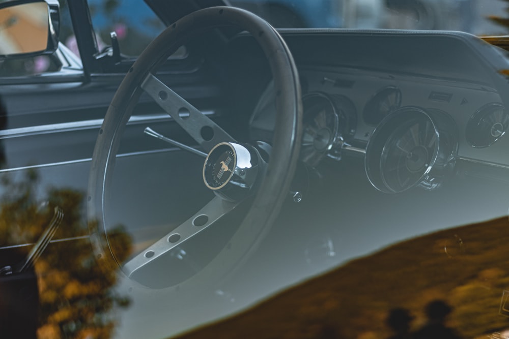 the interior of a car with a steering wheel