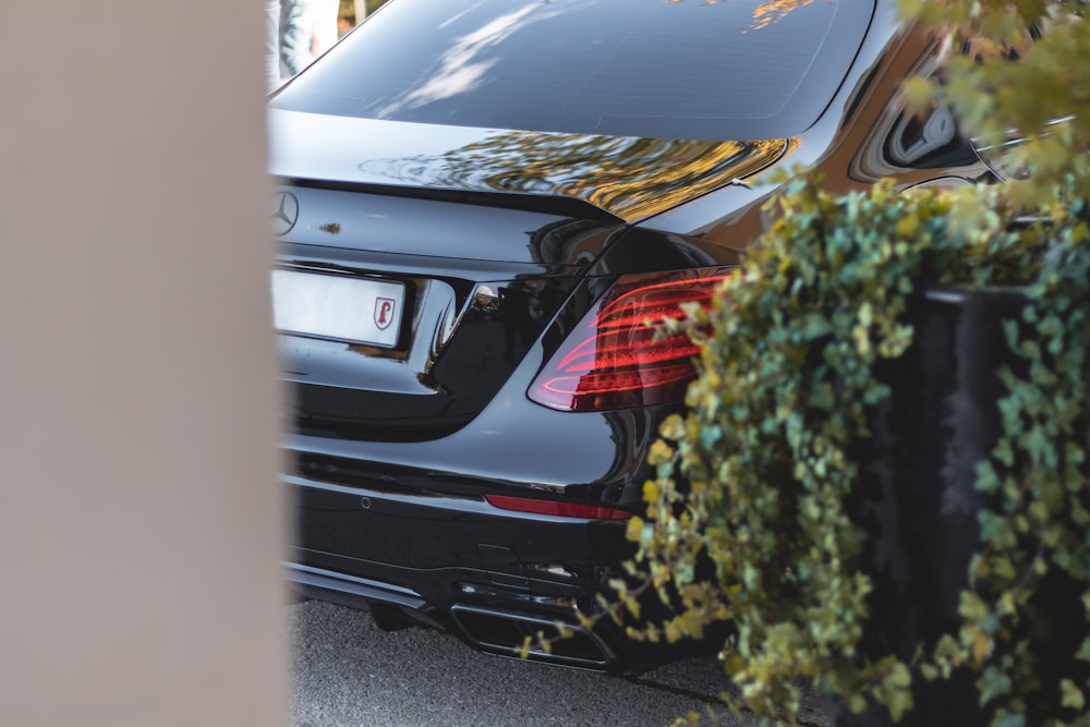 a black car parked in front of a building