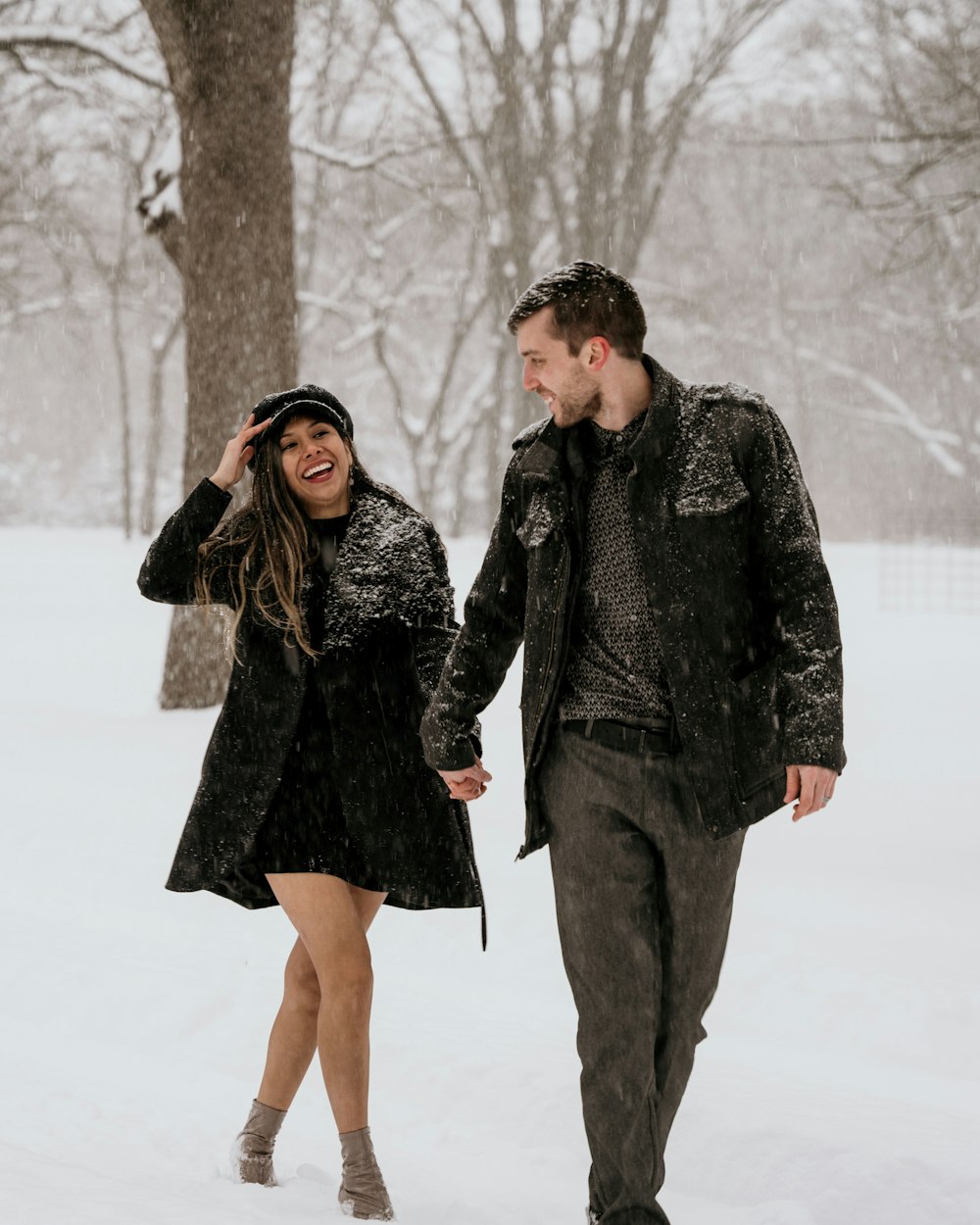 a man and a woman walking in the snow