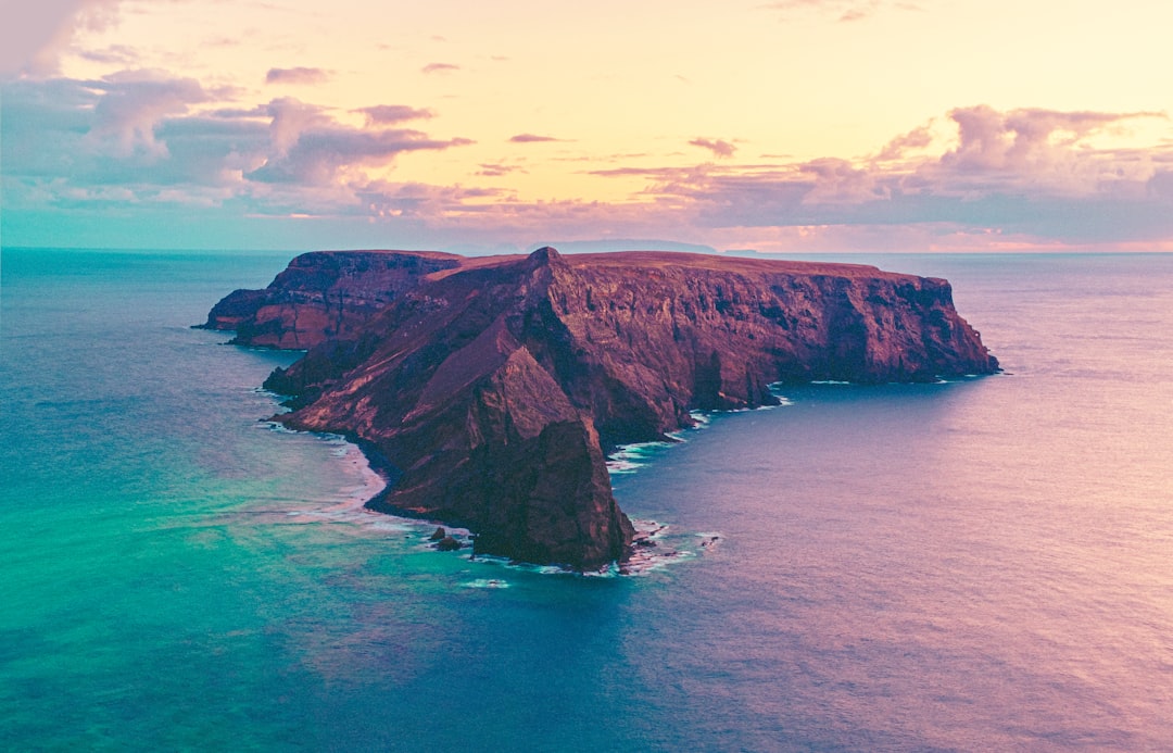 a large body of water next to a large mountain, Porto Santo island, Portugal<p></figure>👋 Small donation -> huge appreciation paypal.me/DanieleFranchi 🙏🙏🙏</p><p>88