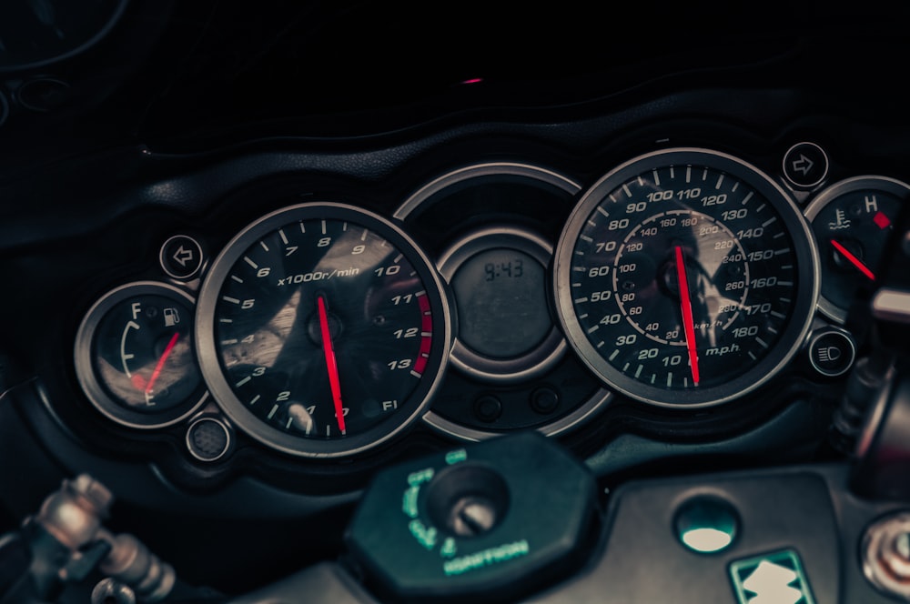 a close up of a speedometer and gauges on a motorcycle