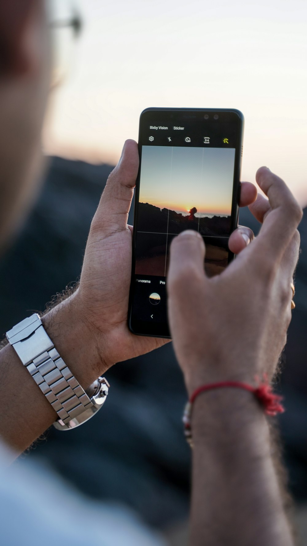 a man holding a smart phone in his hand