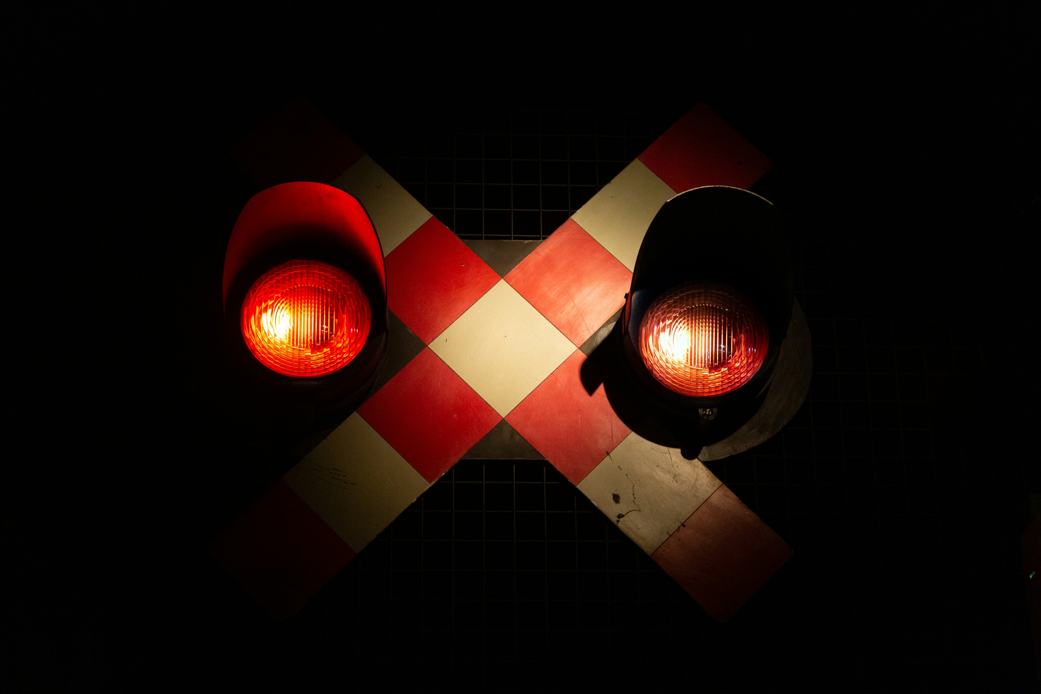 a traffic light sitting on top of a checkered floor