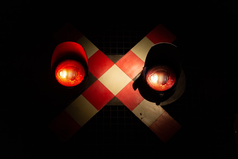 a traffic light sitting on top of a checkered floor