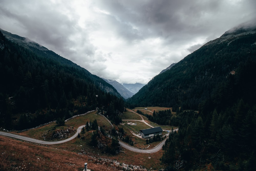 a scenic view of a road in the mountains