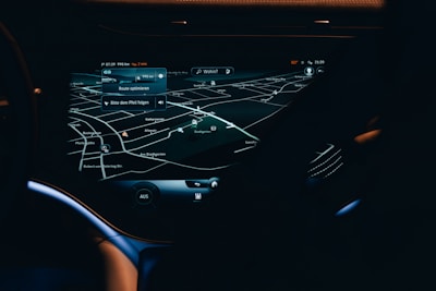 A sleek car dashboard with the moviaz app showing a booking confirmation.