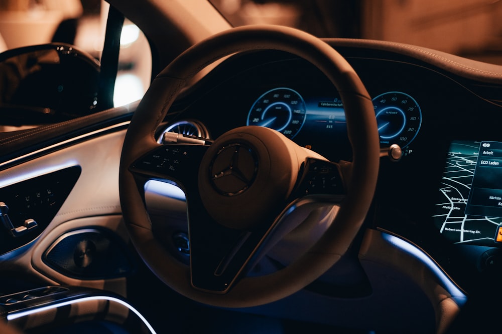 a steering wheel and dashboard of a car