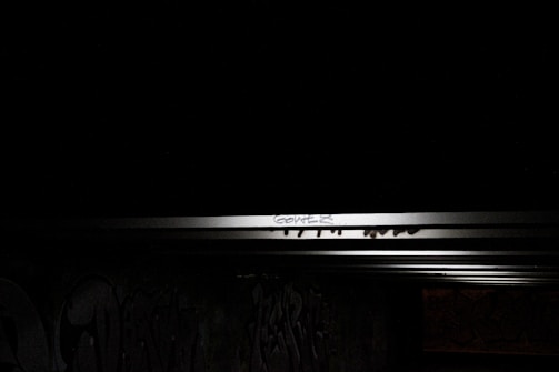 Ultrakin cap displayed on a graffiti-covered wall under soft natural light