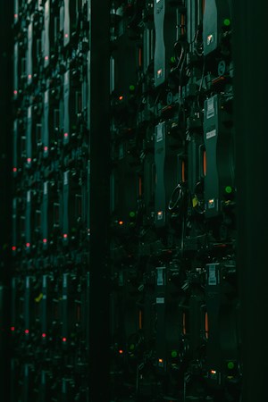 Rows of racked electronic equipment inside a data center facility, the type of use Boulder City voters are being asked about
