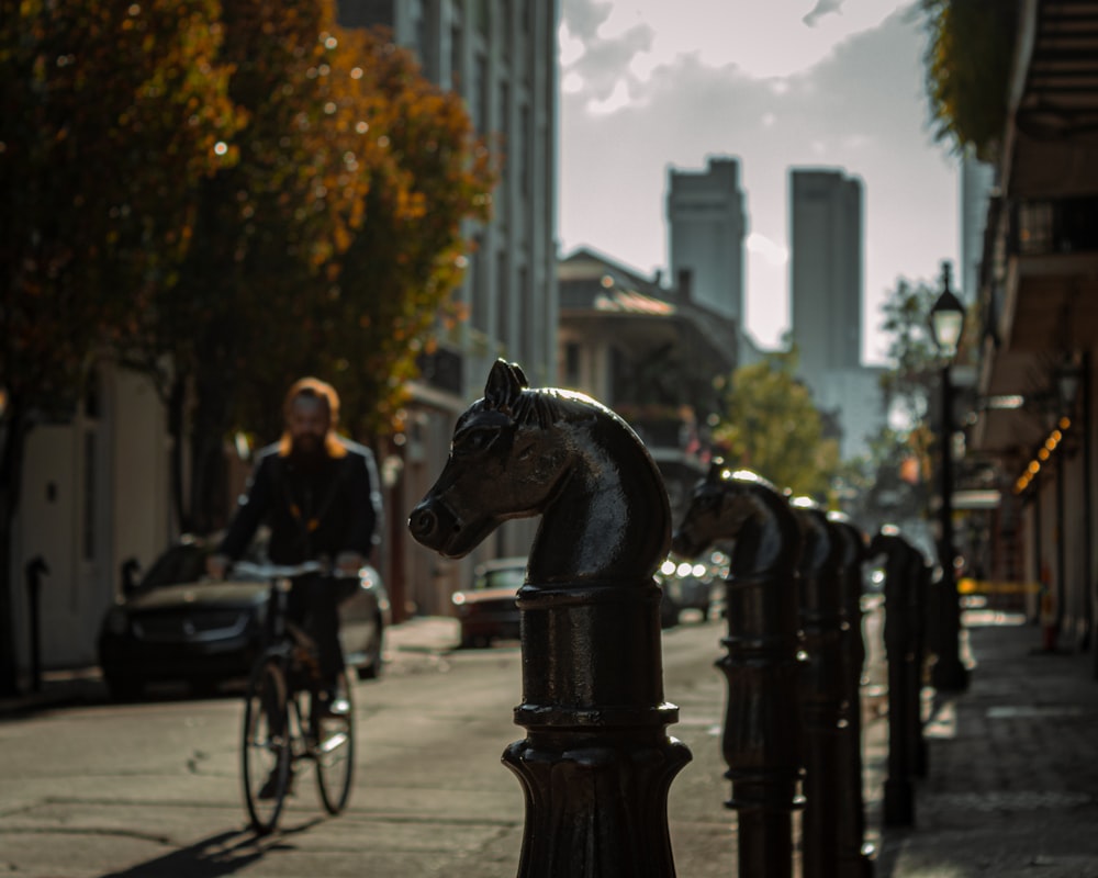 a person riding a bike on a city street