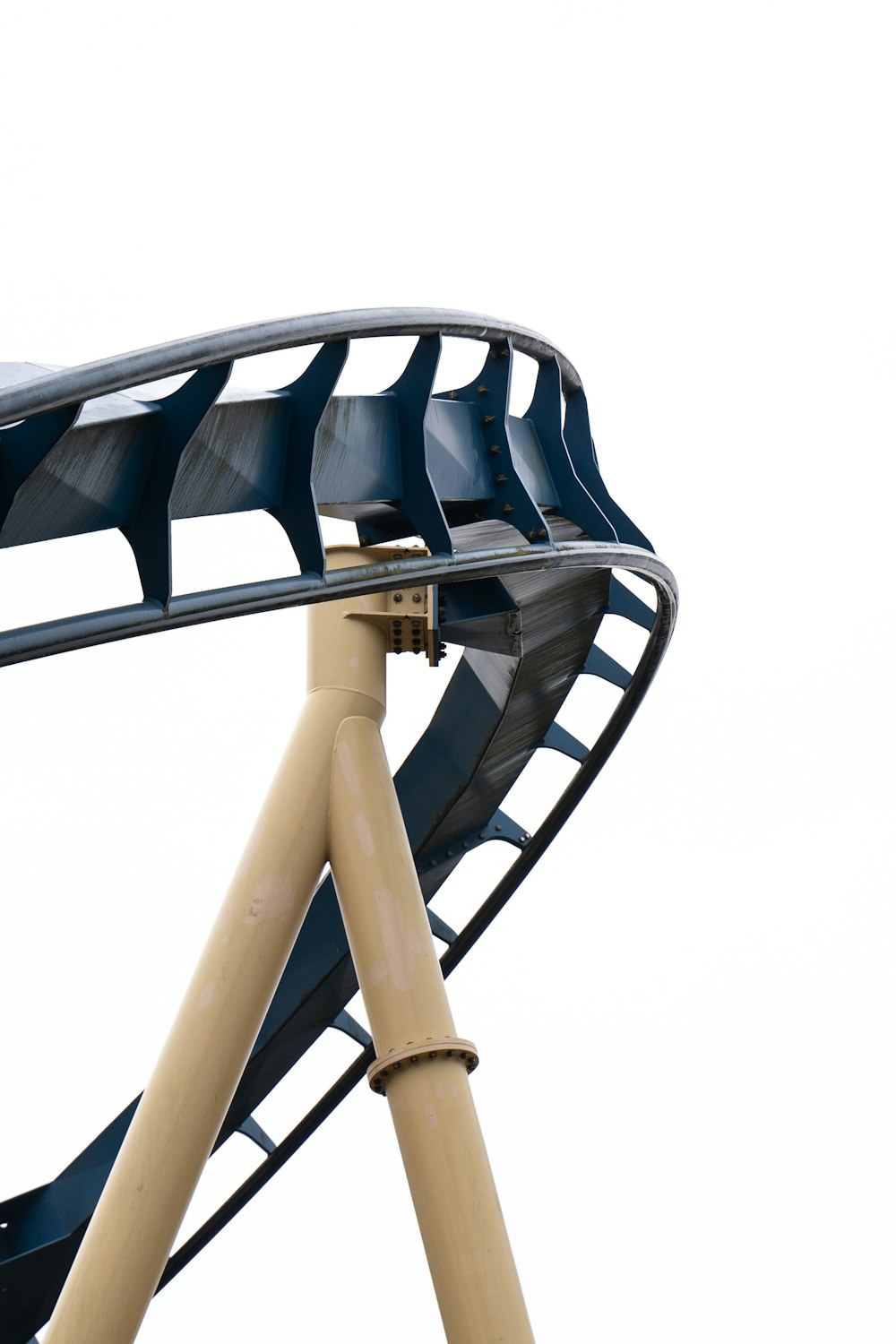 a close up of a roller coaster on a white background