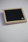 A miniature yellow color board, neatly named below.
