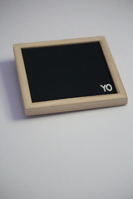 A miniature yellow color board, neatly named below.