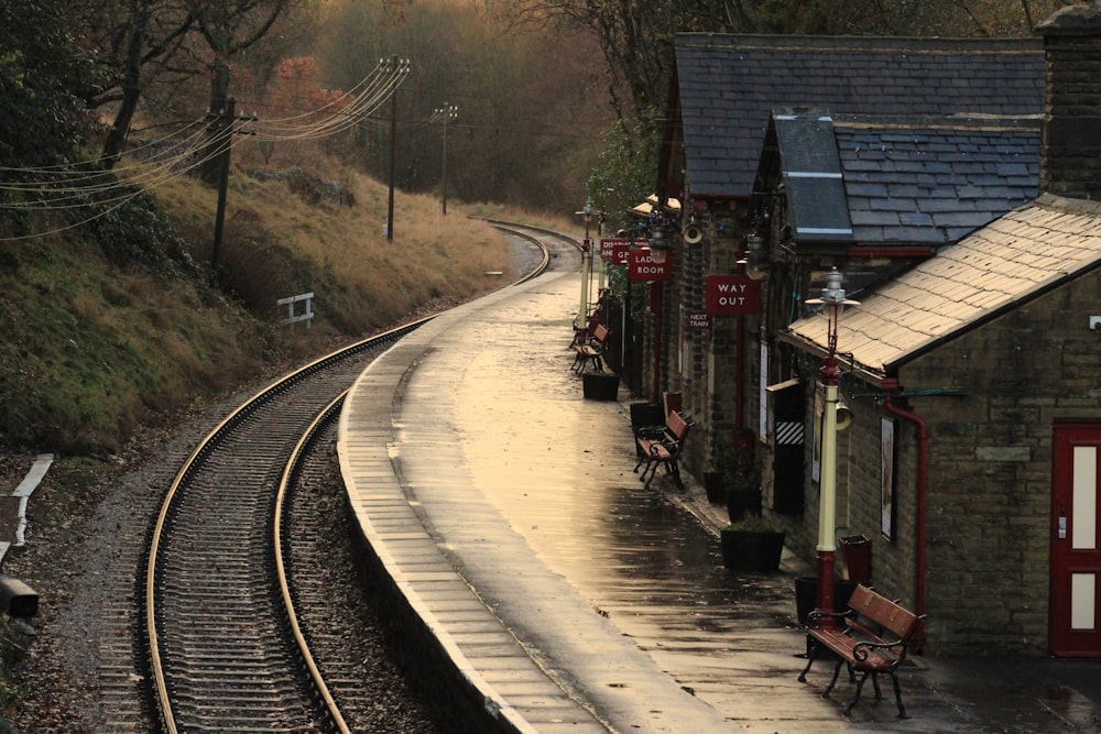 a train track next to a train station