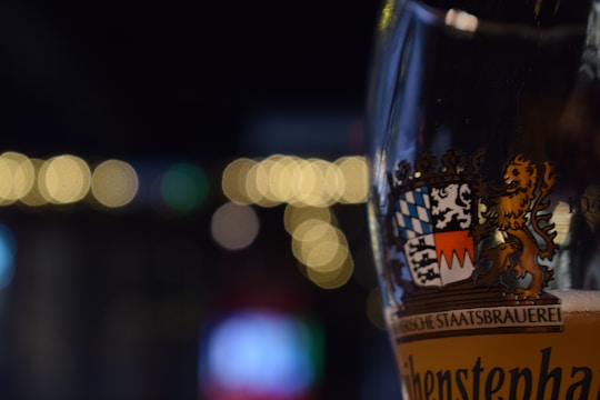 Close-up of custom printed glasses and mugs with vibrant logos.