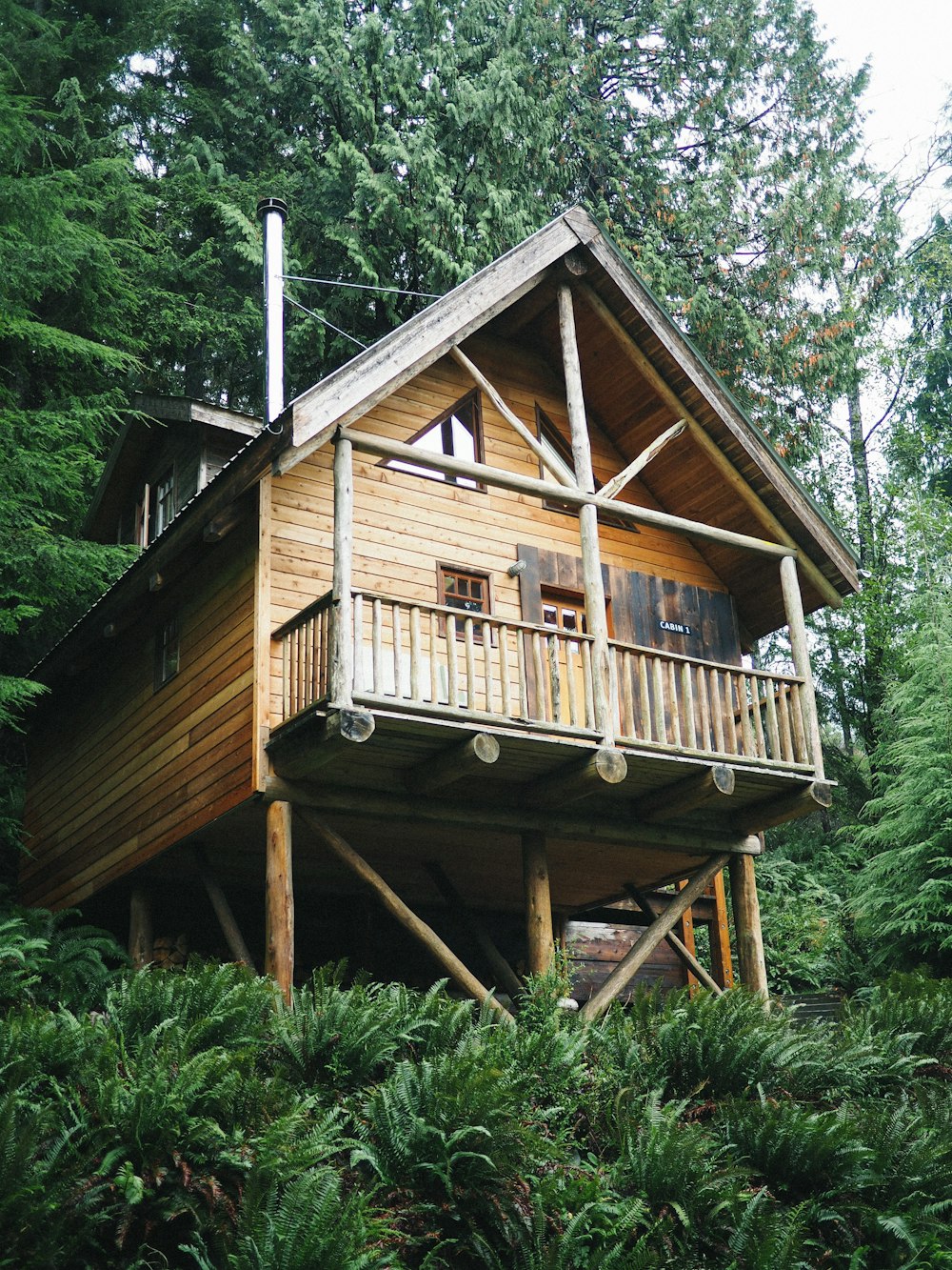 a wooden cabin in the middle of a forest