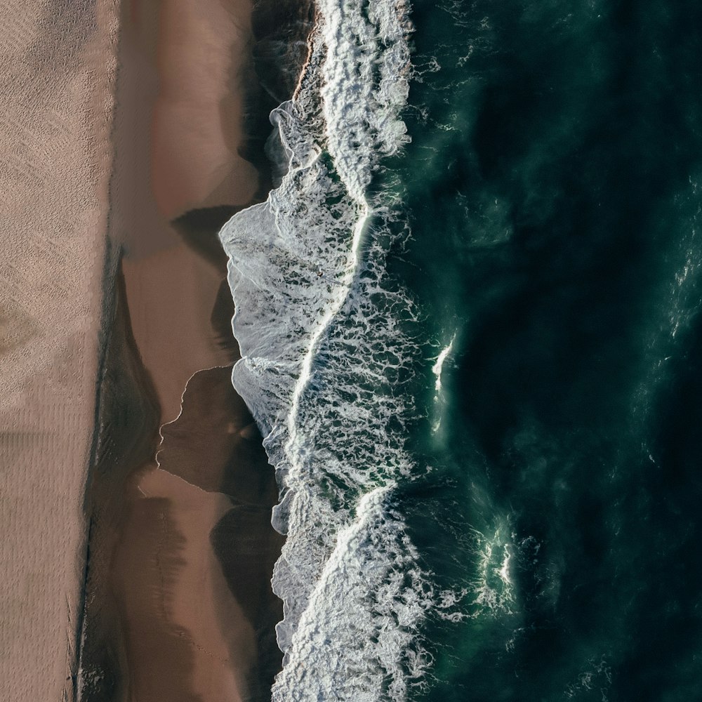 an aerial view of a beach and ocean