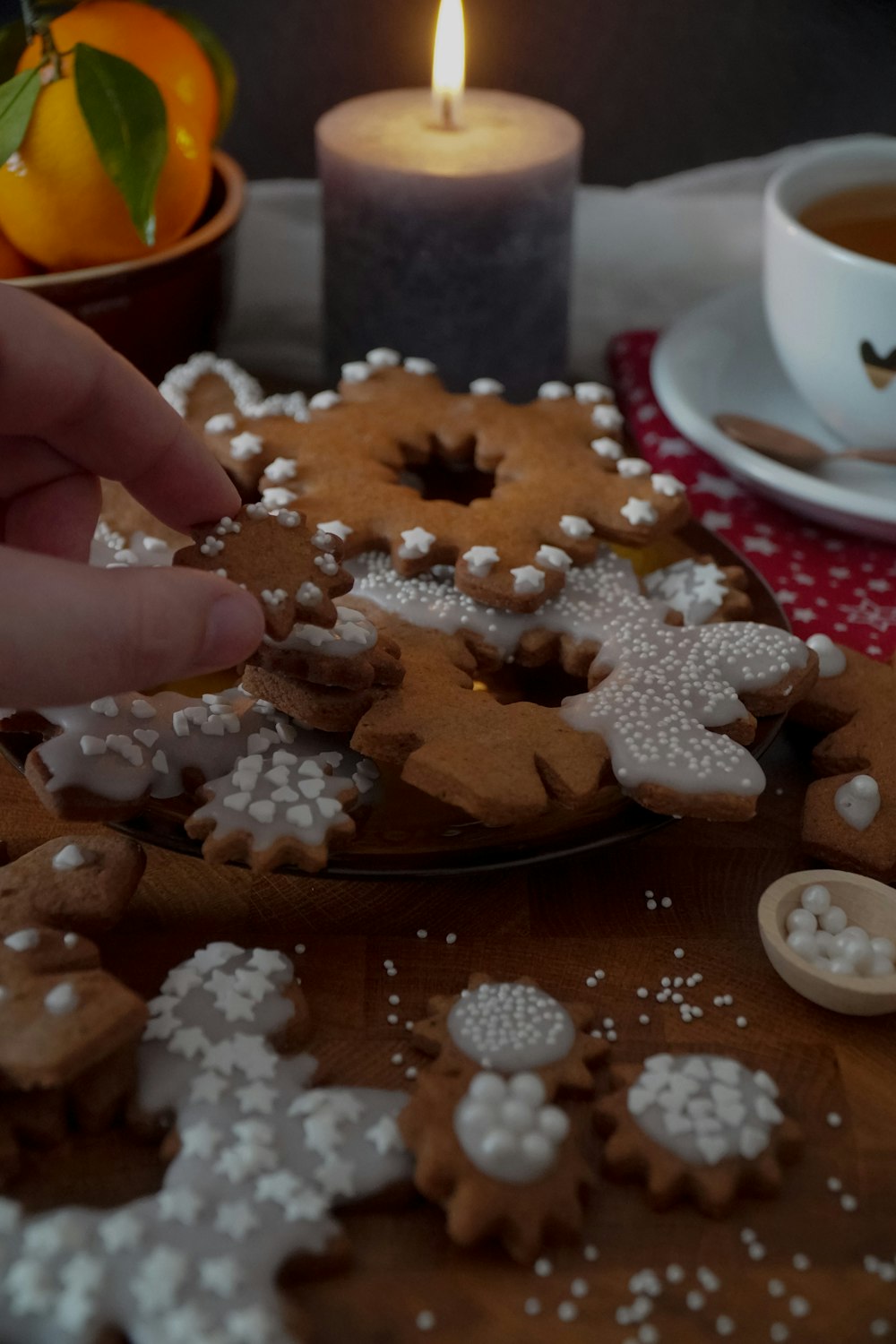 a person is decorating a gingerbread with icing