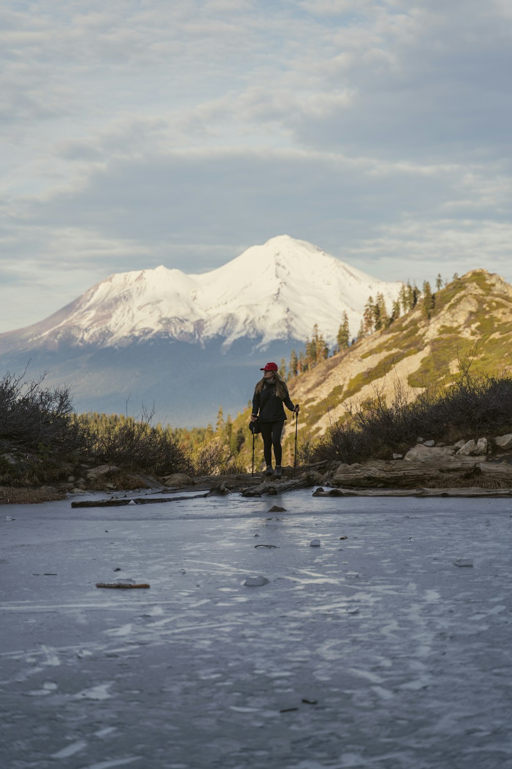 a man standing on a rock in the middle of a river