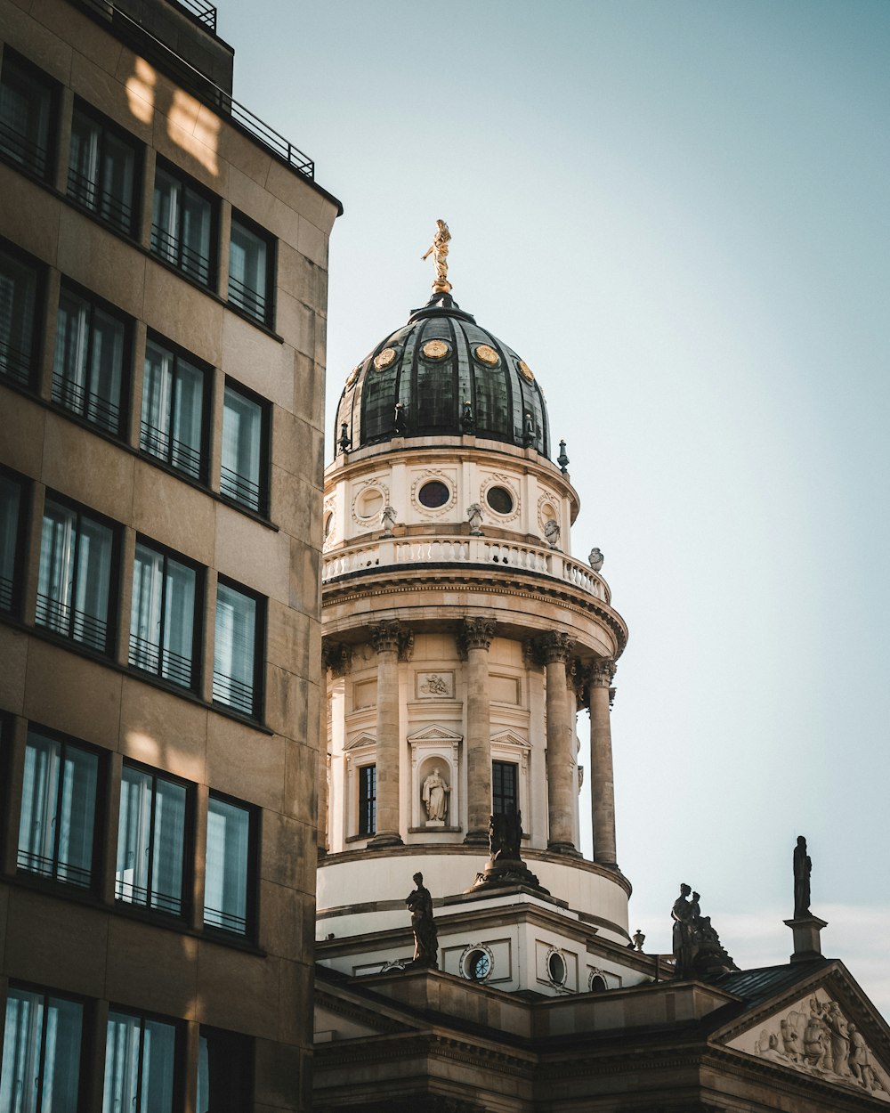 a tall building with a dome on top of it