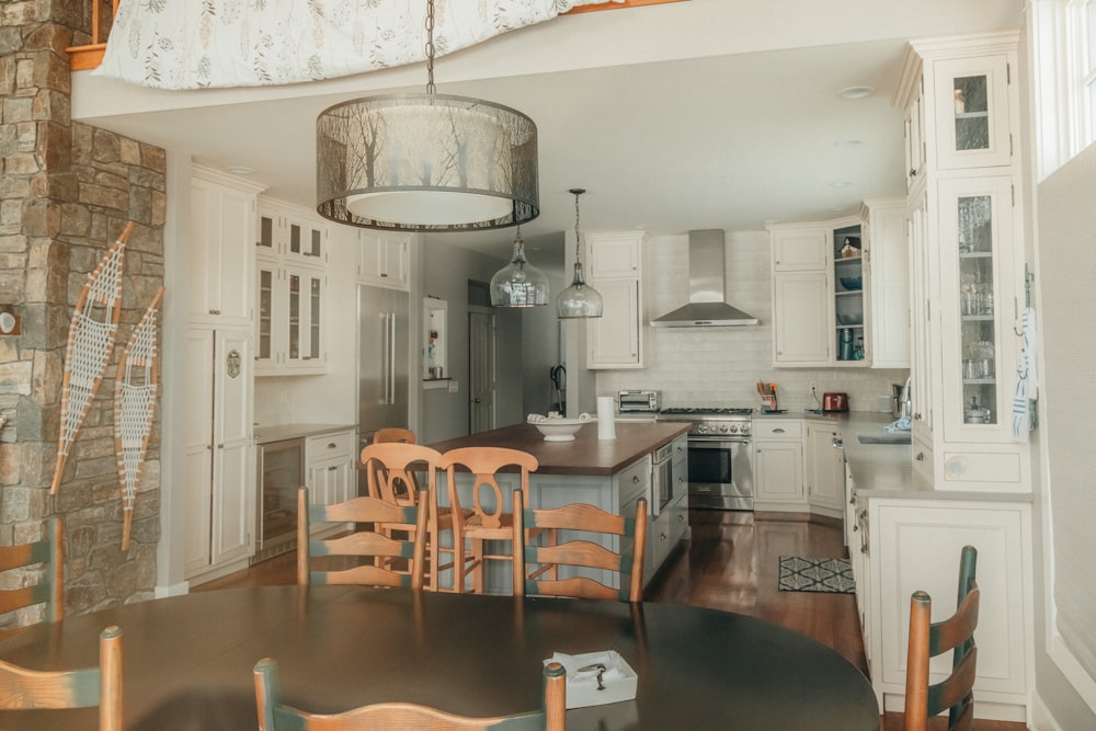 a kitchen with a table and chairs in it