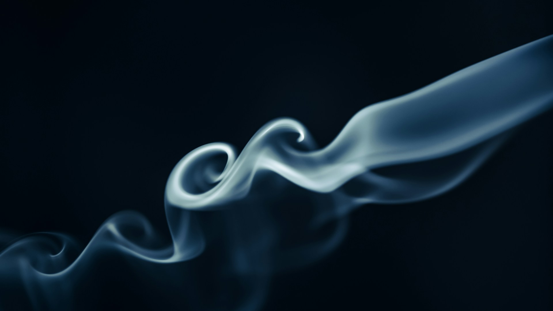 a blue and white smoke texture on a black background