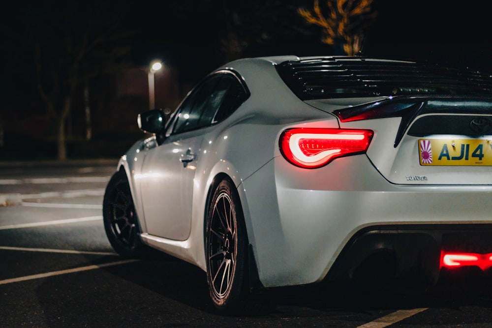 a car parked in a parking lot at night