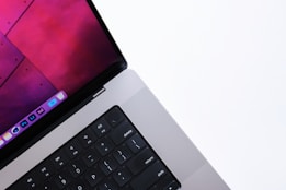 a close up of an apple laptop computer keyboard