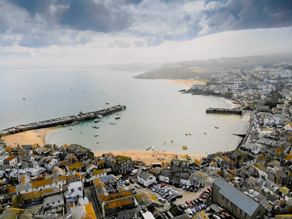 an aerial view of a city and the ocean