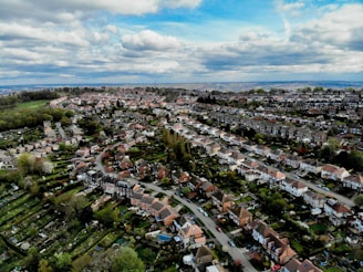 an aerial view of a city with lots of houses