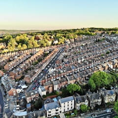 an aerial view of a city with lots of houses