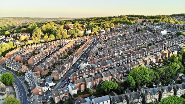 an aerial view of a city with lots of houses