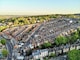 an aerial view of a city with lots of houses