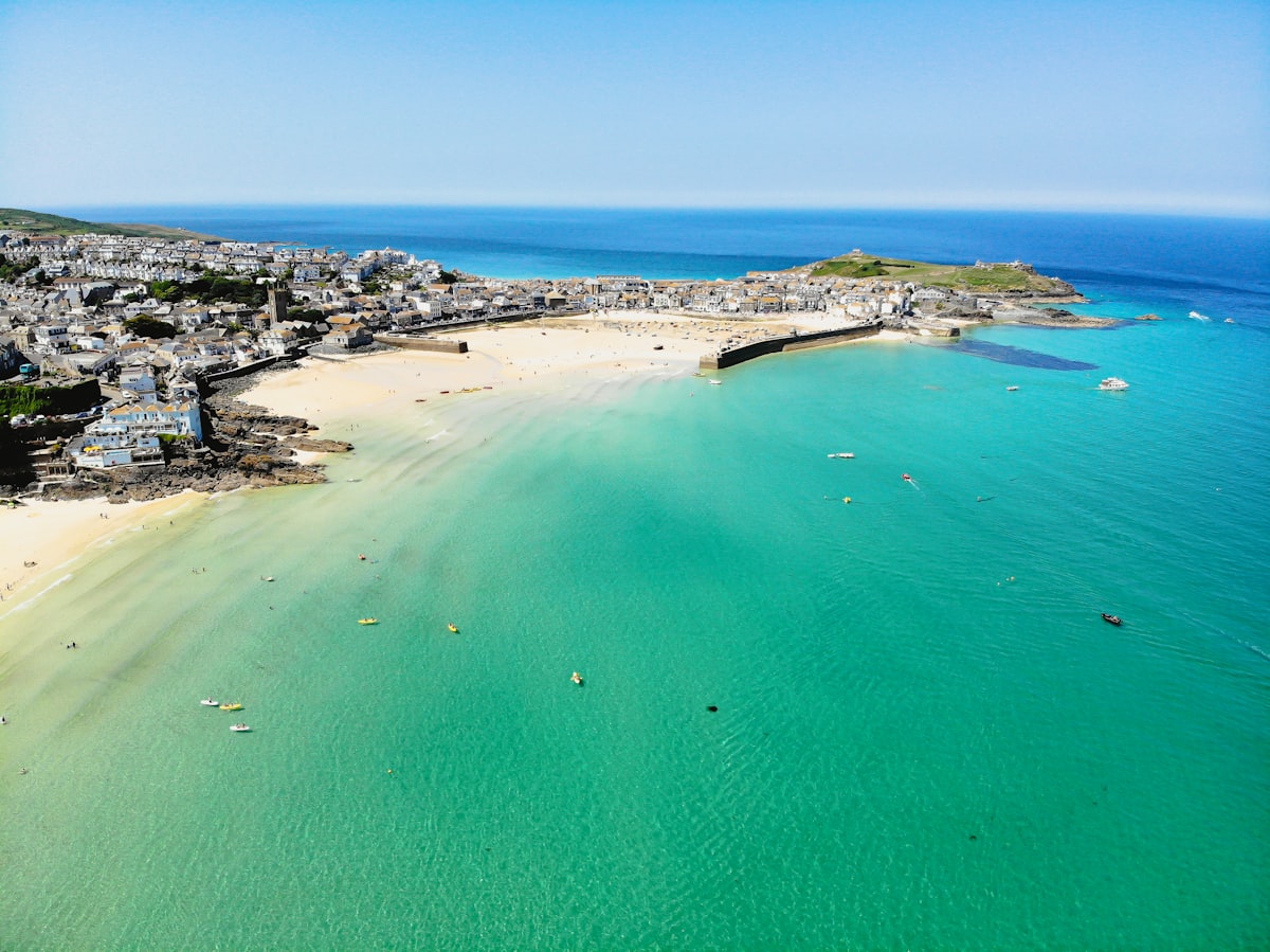 Aerial view of the St Ives coast in Cornwall, showing the beach, town and surrounding landscape