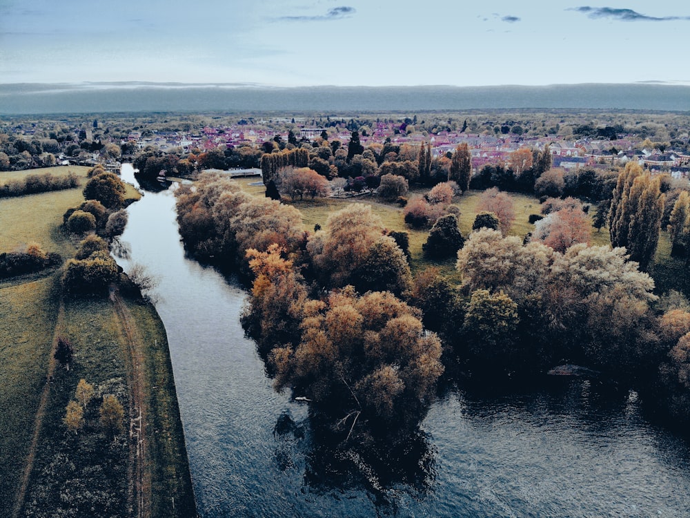 a river running through a lush green countryside