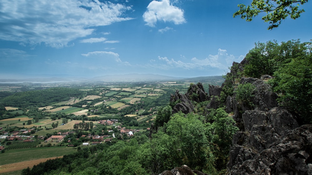 a scenic view of the countryside from the top of a mountain