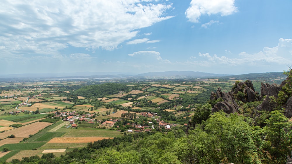 a scenic view of the countryside from a high cliff