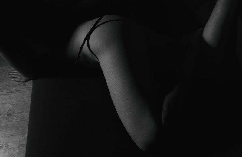a black and white photo of a naked woman