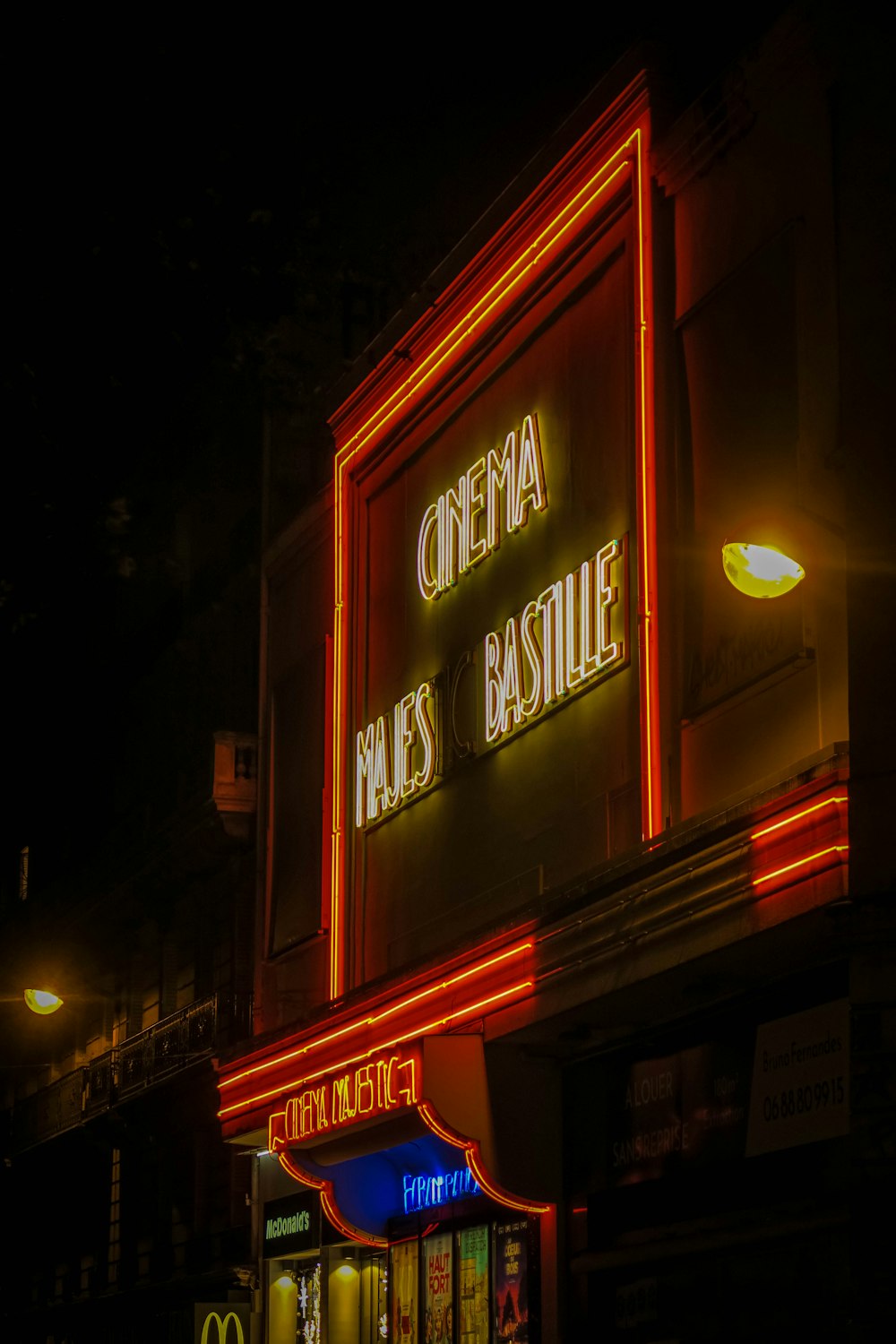 a neon sign on the side of a building