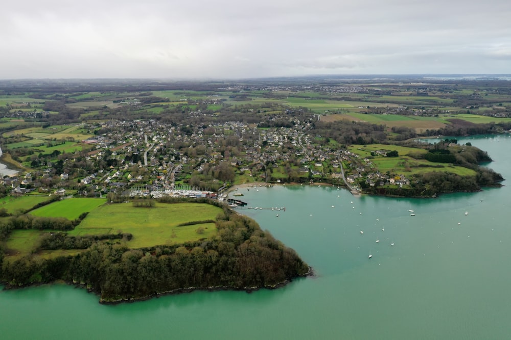 an aerial view of a city and a lake