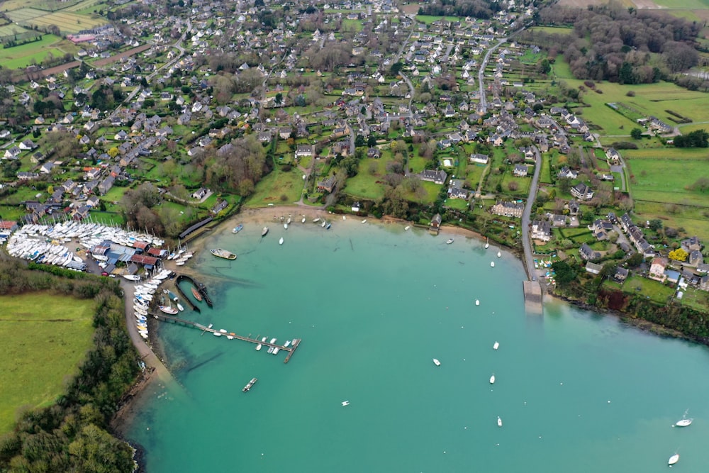 an aerial view of a town and a lake