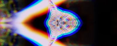 an abstract image of a flower in blue, yellow, and pink