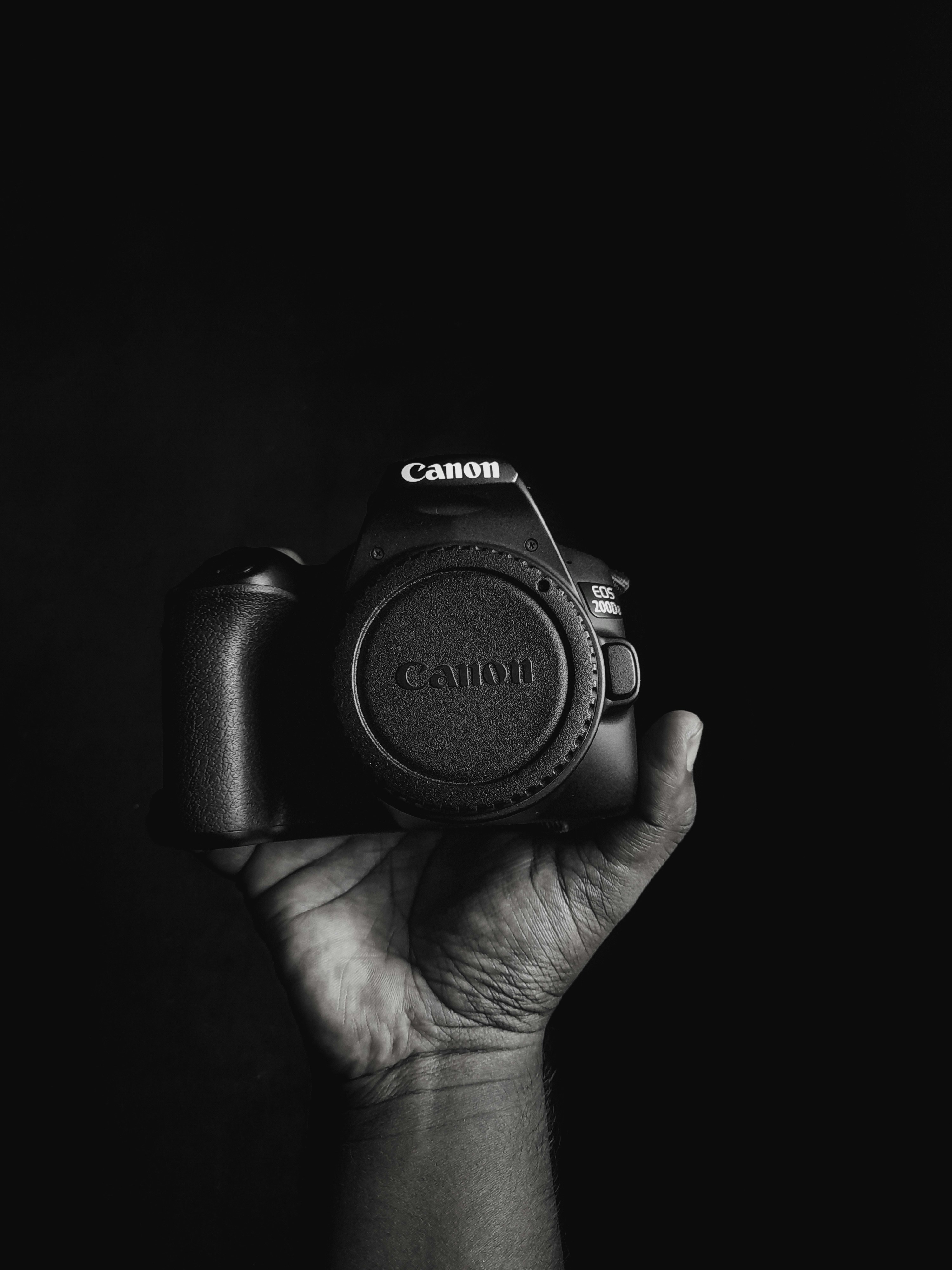 a person holding a camera in their hand