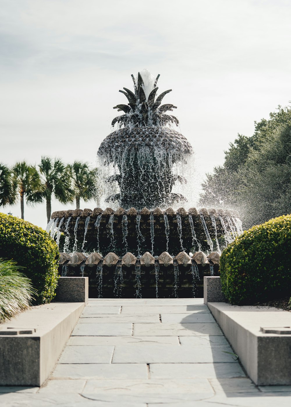 a fountain with a pineapple on top of it
